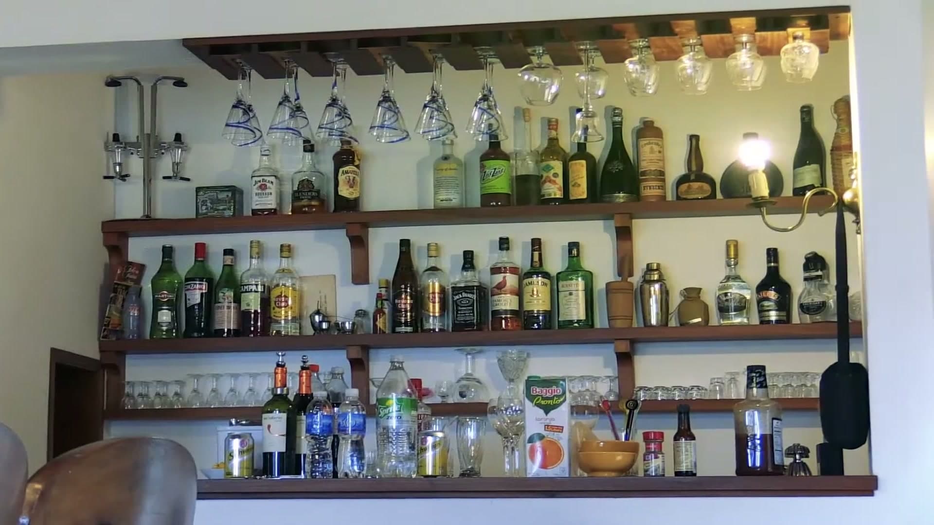 The lodge's bar shelf, stocked with wine and spirits